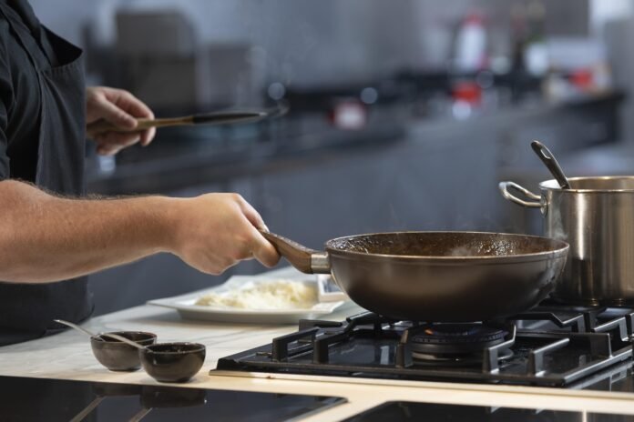 male-chef-kitchen-cooking-close-up-min